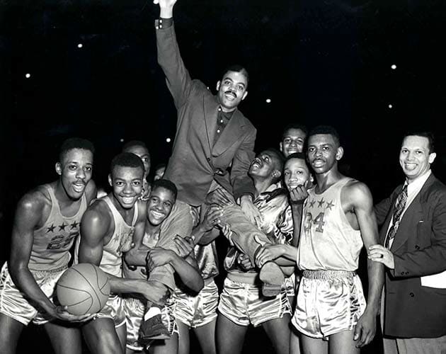 Crispus Attucks celebrates a victory after its regional title in 1954.